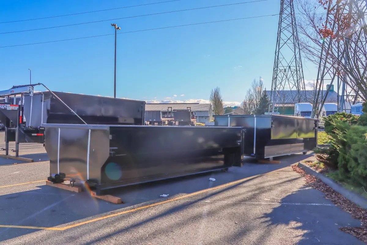 Roll-off dumpster ready for waste disposal at job site for Yard Waste Dumpster Rental in Woodland Park
